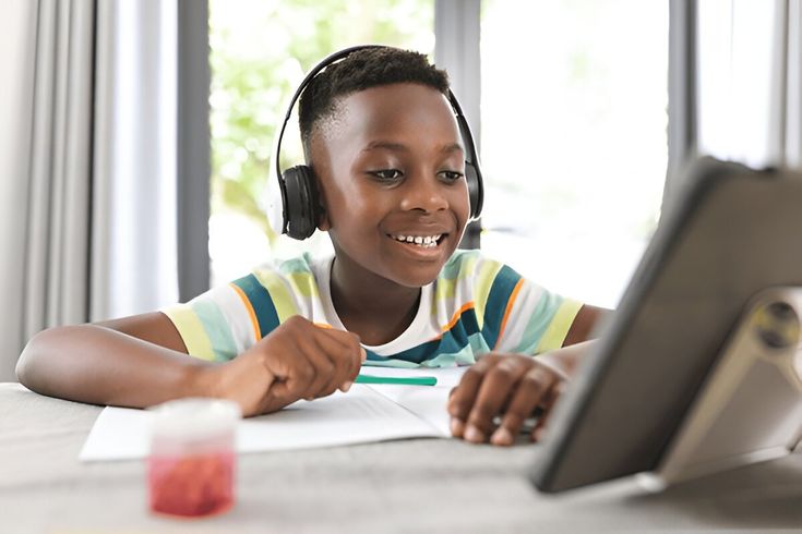 Student practising with tablet and headphones
